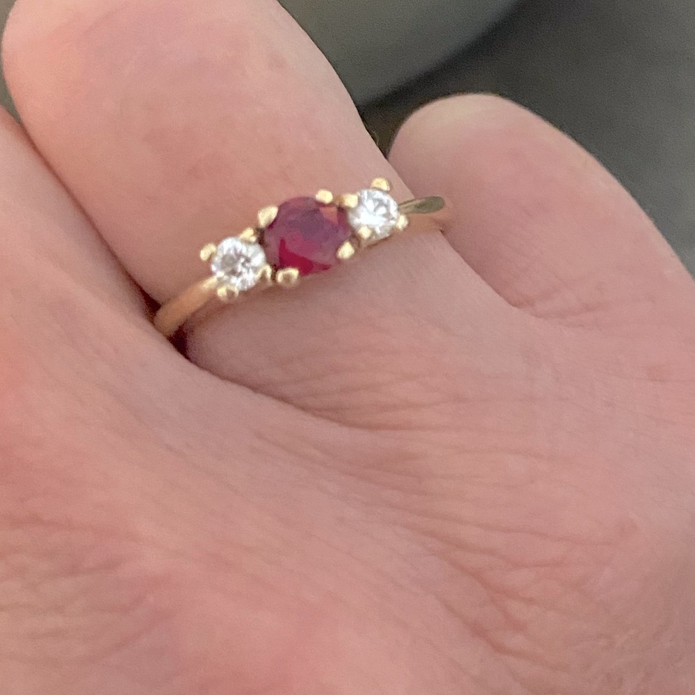 10k Gold-3 stone birthstone ring. 2 genuine diamonds and 1 genuine garnet.